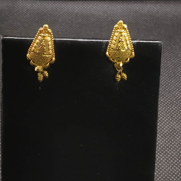 Gold earrings by S.P. Jewellers