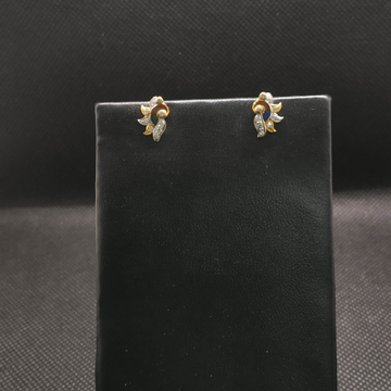 Gold diamond earrings by S.P. Jewellers